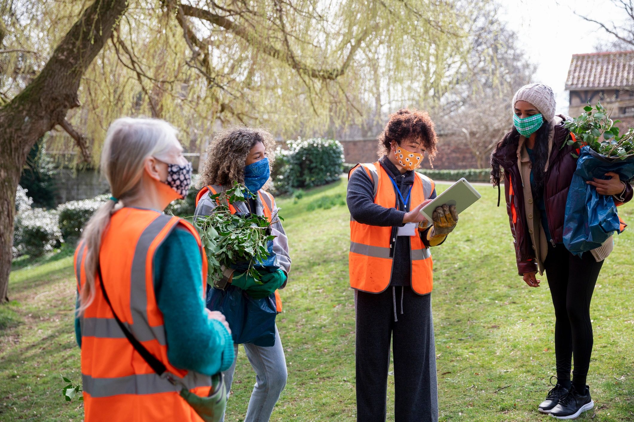 Leaders collaborating and reviewing a plan on a tablet