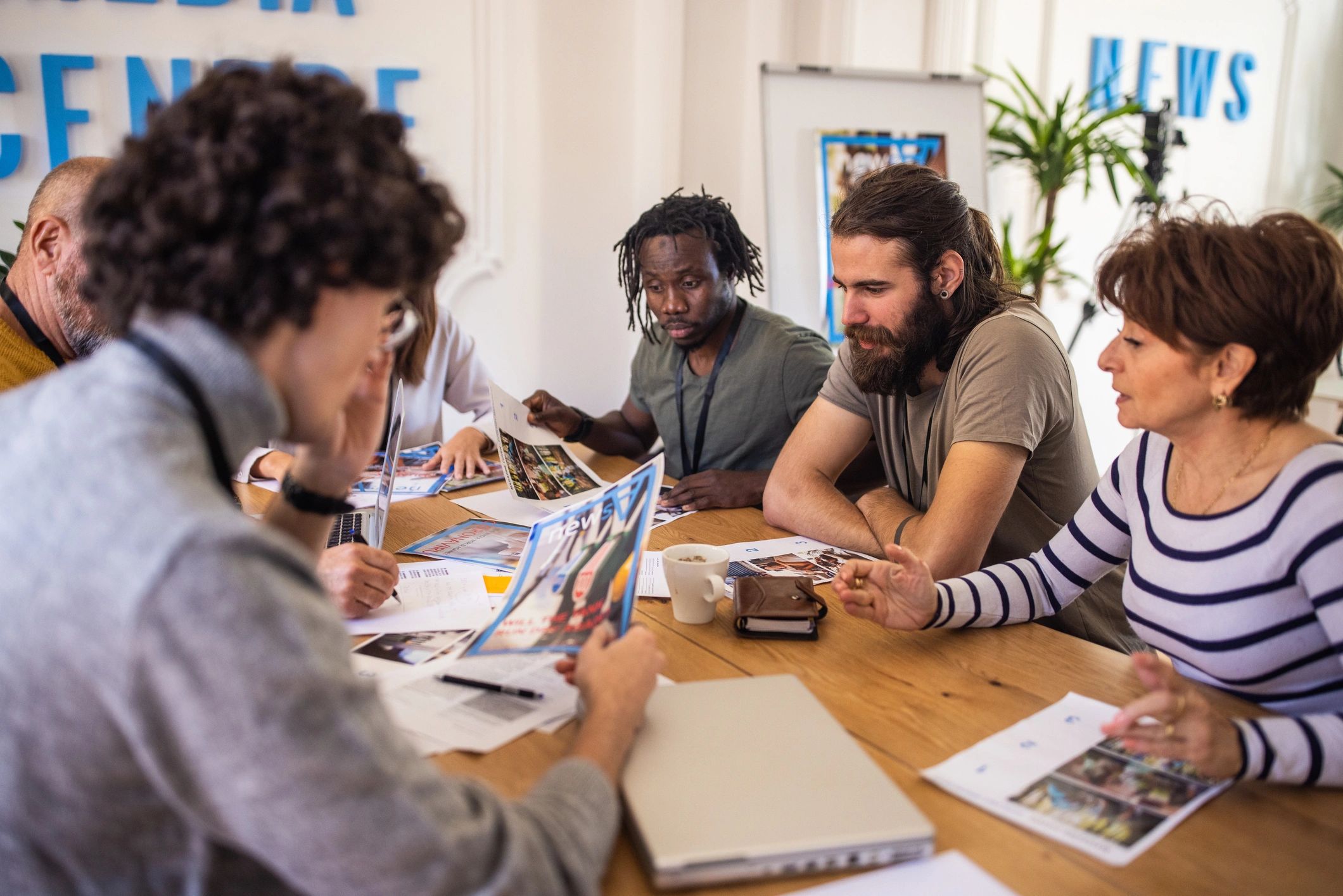 Team meeting with notes and planning materials