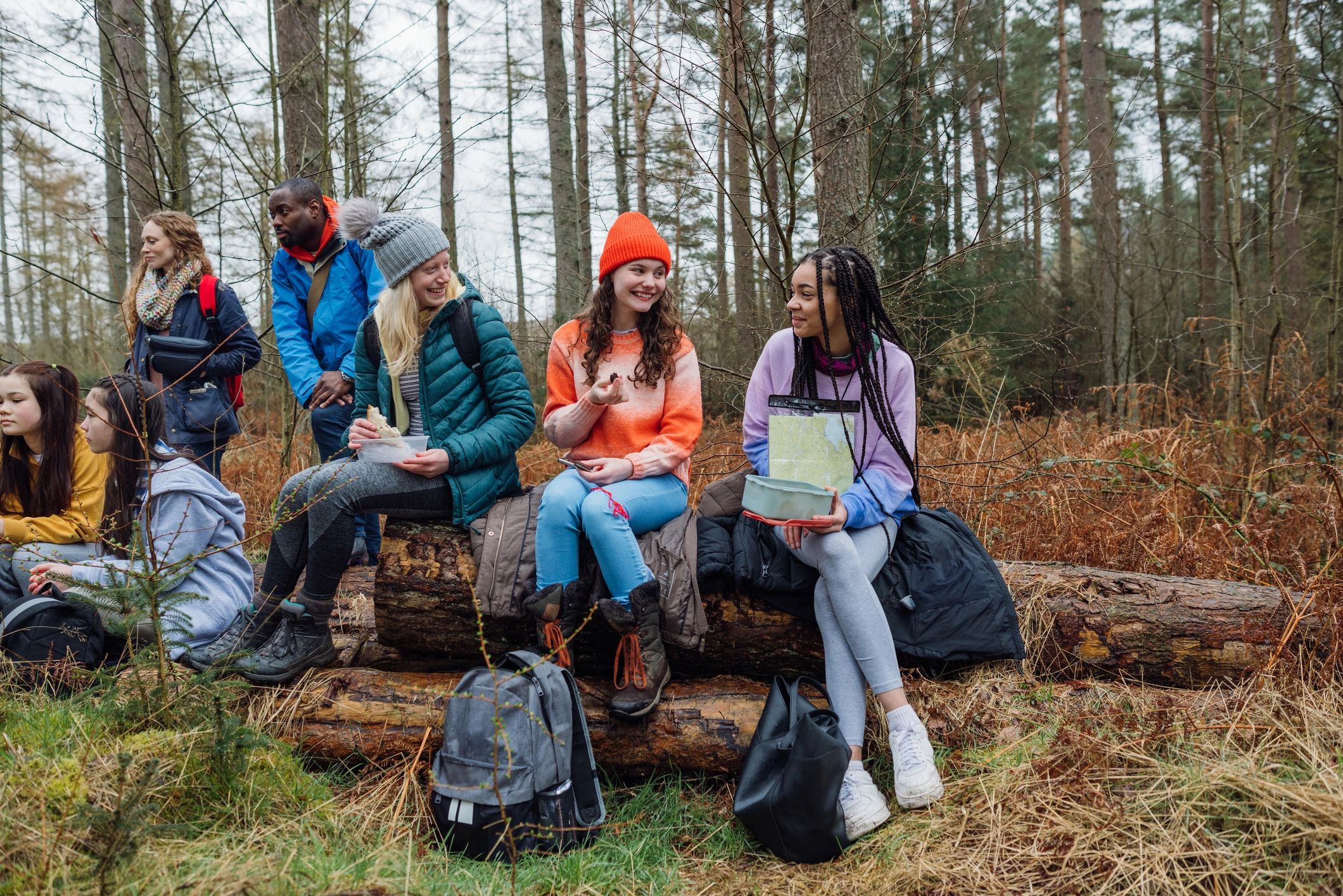 Group taking a break outdoors during a field trip